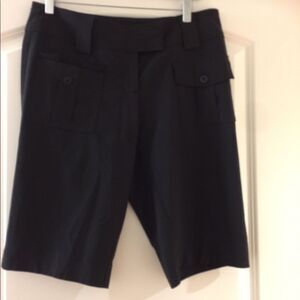 Black cache shorts above or around knee
